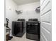 Bright laundry room, complete with washer, dryer, and shelving at 134 Vistawood Dr, Charleston, SC 29414