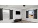 Living room with hardwood floors, barn doors, and mounted television at 134 Vistawood Dr, Charleston, SC 29414