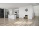 Open living space with hardwood floors, kitchen island, and barn door accents at 134 Vistawood Dr, Charleston, SC 29414