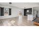 Spacious living room with hardwood floors, sliding doors, and kitchen island at 134 Vistawood Dr, Charleston, SC 29414