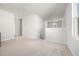 Spacious loft area with neutral carpeting and a window offering natural light at 134 Vistawood Dr, Charleston, SC 29414