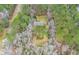 House nestled in a wooded area, seen from above at 1575 Tacky Point Rd, Wadmalaw Island, SC 29487