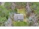 Aerial view of a secluded home surrounded by lush greenery, offering a private retreat at 1575 Tacky Point Rd, Wadmalaw Island, SC 29487
