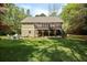 The home offers an inviting backyard with a cozy fire pit and ample space for outdoor gatherings at 1575 Tacky Point Rd, Wadmalaw Island, SC 29487