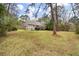 Spacious backyard with large deck and fire pit at 1575 Tacky Point Rd, Wadmalaw Island, SC 29487