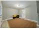 Bright and airy basement room with large area rug at 1575 Tacky Point Rd, Wadmalaw Island, SC 29487