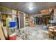 Partially finished basement workshop area with shelving at 1575 Tacky Point Rd, Wadmalaw Island, SC 29487