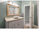 Clean bathroom with a modern vanity and a large mirror at 1575 Tacky Point Rd, Wadmalaw Island, SC 29487