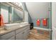 Double vanity bathroom with modern sinks and a view of the bedroom at 1575 Tacky Point Rd, Wadmalaw Island, SC 29487
