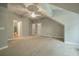 Bright bedroom with two doors and a ceiling fan at 1575 Tacky Point Rd, Wadmalaw Island, SC 29487