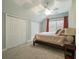 Charming bedroom with double closets and a ceiling fan at 1575 Tacky Point Rd, Wadmalaw Island, SC 29487