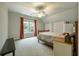Comfortable bedroom with a window and coral curtains at 1575 Tacky Point Rd, Wadmalaw Island, SC 29487