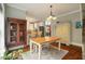 Charming dining area with a wooden table and built-in cabinetry at 1575 Tacky Point Rd, Wadmalaw Island, SC 29487