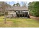 Two story house with deck and stairs at 1575 Tacky Point Rd, Wadmalaw Island, SC 29487
