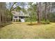 Two story house with front porch and landscaping at 1575 Tacky Point Rd, Wadmalaw Island, SC 29487