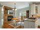 Kitchen with granite countertops and a rustic wood accent wall at 1575 Tacky Point Rd, Wadmalaw Island, SC 29487
