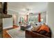 Comfortable living room with hardwood floors and access to a deck at 1575 Tacky Point Rd, Wadmalaw Island, SC 29487