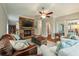 Bright living room with hardwood floors and a rustic fireplace at 1575 Tacky Point Rd, Wadmalaw Island, SC 29487