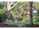 Rustic wooden patio set in a tranquil garden setting at 1750 Ion Ave, Sullivans Island, SC 29482