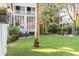 Expansive grassy backyard with mature trees and landscaping at 1750 Ion Ave, Sullivans Island, SC 29482