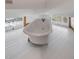 White clawfoot bathtub with windows offering views of the neighborhood at 1750 Ion Ave, Sullivans Island, SC 29482