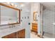 Modern bathroom with marble vanity, wooden cabinets, and white subway tile shower at 1750 Ion Ave, Sullivans Island, SC 29482