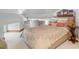 Cozy bedroom with patterned bedding, small side table, and built-in desk at 1750 Ion Ave, Sullivans Island, SC 29482