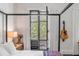 Bedroom with private balcony access and a view of the lush backyard at 1750 Ion Ave, Sullivans Island, SC 29482