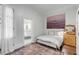 Bright bedroom with en-suite bathroom and decorative rug at 1750 Ion Ave, Sullivans Island, SC 29482