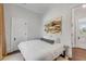 Serene bedroom with plush bedding and access to hallway at 1750 Ion Ave, Sullivans Island, SC 29482