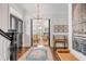 Spacious entryway with hardwood floors, view to living room at 1750 Ion Ave, Sullivans Island, SC 29482