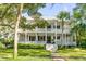 Two story home with wrap around porch and mature landscaping at 1750 Ion Ave, Sullivans Island, SC 29482
