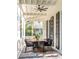 Front porch with dining set and ceiling fan at 1750 Ion Ave, Sullivans Island, SC 29482