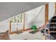 Bright attic gym with French doors, weights, and exercise ball at 1750 Ion Ave, Sullivans Island, SC 29482
