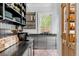 Bright kitchen with stainless steel cabinets and brick flooring at 1750 Ion Ave, Sullivans Island, SC 29482