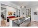 Modern kitchen with wood and stainless steel finishes, a large island, and a brick floor at 1750 Ion Ave, Sullivans Island, SC 29482