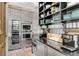 Modern kitchen with stainless steel appliances and brick floor at 1750 Ion Ave, Sullivans Island, SC 29482