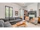 Spacious living room with a gray sectional sofa and two armchairs at 1750 Ion Ave, Sullivans Island, SC 29482