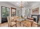 Charming living room with fireplace and French doors at 1750 Ion Ave, Sullivans Island, SC 29482
