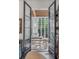 Home office with French doors opening to a sunroom at 1750 Ion Ave, Sullivans Island, SC 29482