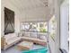 Spacious outdoor porch with sectional sofa and glass coffee table at 1750 Ion Ave, Sullivans Island, SC 29482