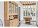 Sunroom with built-in wooden cabinetry and a view of the backyard at 1750 Ion Ave, Sullivans Island, SC 29482