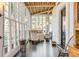 Bright sunroom with a table and chairs, perfect for dining at 1750 Ion Ave, Sullivans Island, SC 29482