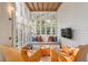 Relaxing sunroom with a sofa and two armchairs at 1750 Ion Ave, Sullivans Island, SC 29482