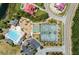 Community pool, tennis courts, and playground from above at 1800 Palmetto Isle Dr, Mount Pleasant, SC 29466