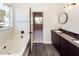 Modern bathroom with double vanity, walk-in shower, and dark wood cabinets at 1800 Palmetto Isle Dr, Mount Pleasant, SC 29466