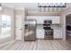 White kitchen cabinets and stainless steel appliances at 1800 Palmetto Isle Dr, Mount Pleasant, SC 29466