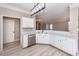 Updated kitchen with white cabinets and island at 1800 Palmetto Isle Dr, Mount Pleasant, SC 29466