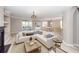 Spacious living room with L-shaped sofa and fireplace at 1800 Palmetto Isle Dr, Mount Pleasant, SC 29466