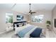 Spacious main bedroom with a large bed, ample natural light, and a sitting bench at 1800 Palmetto Isle Dr, Mount Pleasant, SC 29466